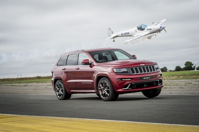 Jeep Grand Cherokee vs Aerobatic Twister Plane